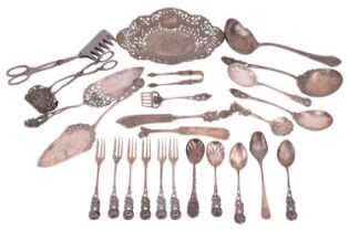 A collection of mixed items comprising matching utensils with rose and foliage design by