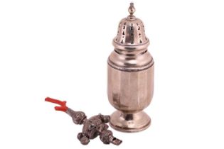 A silver sugar shaker together with a coral set teething bells and whistle rattle. The sugar shaker 