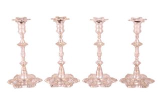 A set of four American reproduction silver-plated candlesticks, after the 18th-century silver origin