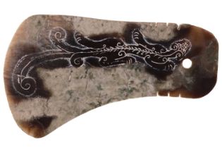 An archaic Chinese green and white variegated jade ritual axe head (Yue) Probably Zhou Dynasty, bear