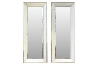 A pair of rectangular modern wall mirrors with raised beveled border and spangled raindrop effect de