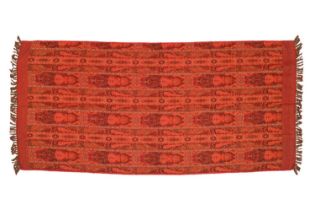 A russet red ground Paisley shawl with tasselled ends, 236 cm x 98 cm