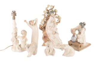 Collection of Lladro figures to include a praying angel lamp, a retired Geisha girl, a boy awakening