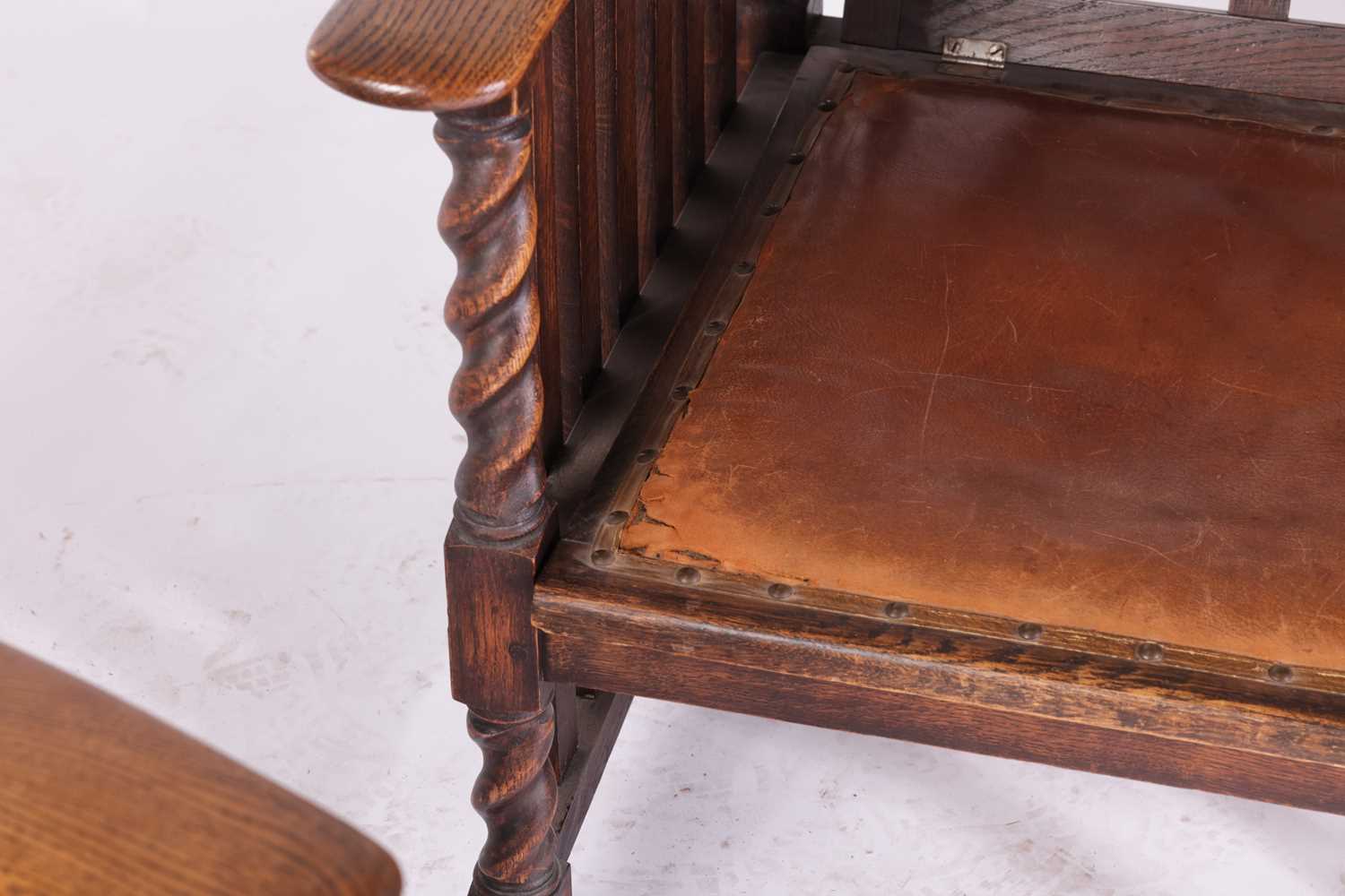 A pair of early twentieth-century reclining oak armchairs in the manner of Jas Shoolbred stood on bu - Image 6 of 6