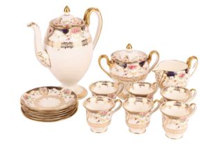 A Wedgwood floral patterned coffee set on white ground with blue and gold decoration, comprising