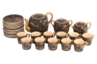 A Japanese matte black Satumsa tea set with gold hand-painted decoration, comprising of a teapot,