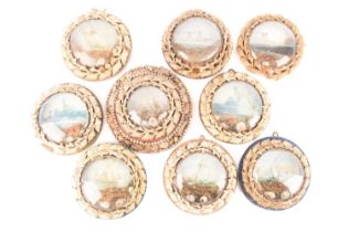 A set of nine sailors' shellwork valentines, each in a circular frame with colour ship print, the la