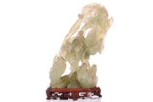 A Chinese carved green Jadeite figure of a courting Pheonix and Dragon, the second half of the