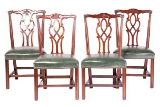 Four George III-style mahogany dining chairs, twentieth century above stuff over close nailed hide s