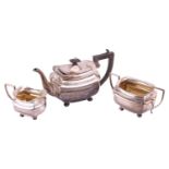 A three-piece silver tea service, Birmingham 1915 by Joseph Gloster Ltd., comprising a teapot, a twi