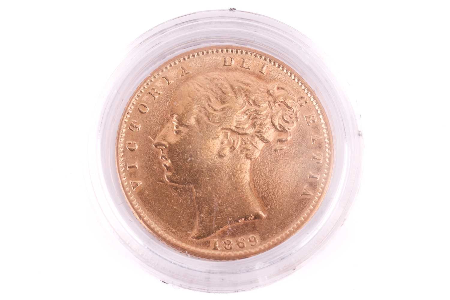 An 1869 Victoria 'young head' Full-Sovereign shield back with a plastic case, circulated. - Image 2 of 2