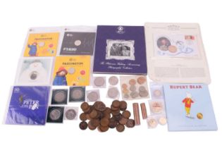A mixed collection of coins including a commemorative Queen Elizabeth II 70th birthday £5 coin,