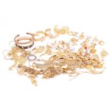 A collection of gold-plated costume jewellery comprising twenty-two rings, seven pairs of earrings, 