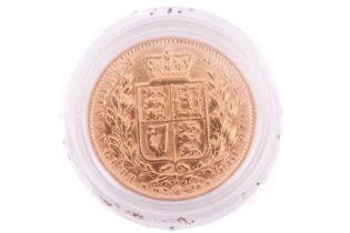 An 1869 Victoria 'young head' Full-Sovereign shield back with a plastic case, circulated.
