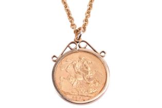 An 1891 Victoria full sovereign in a 9ct gold coin mount all on a yellow metal chain stamped 9ct.