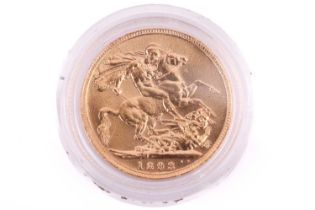 An 1893 Victoria Full-Sovereign with a plastic case, circulated.