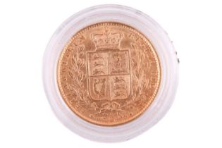 An 1872 Victoria 'Large head' Full-Sovereign shield back with a plastic case, circulated.