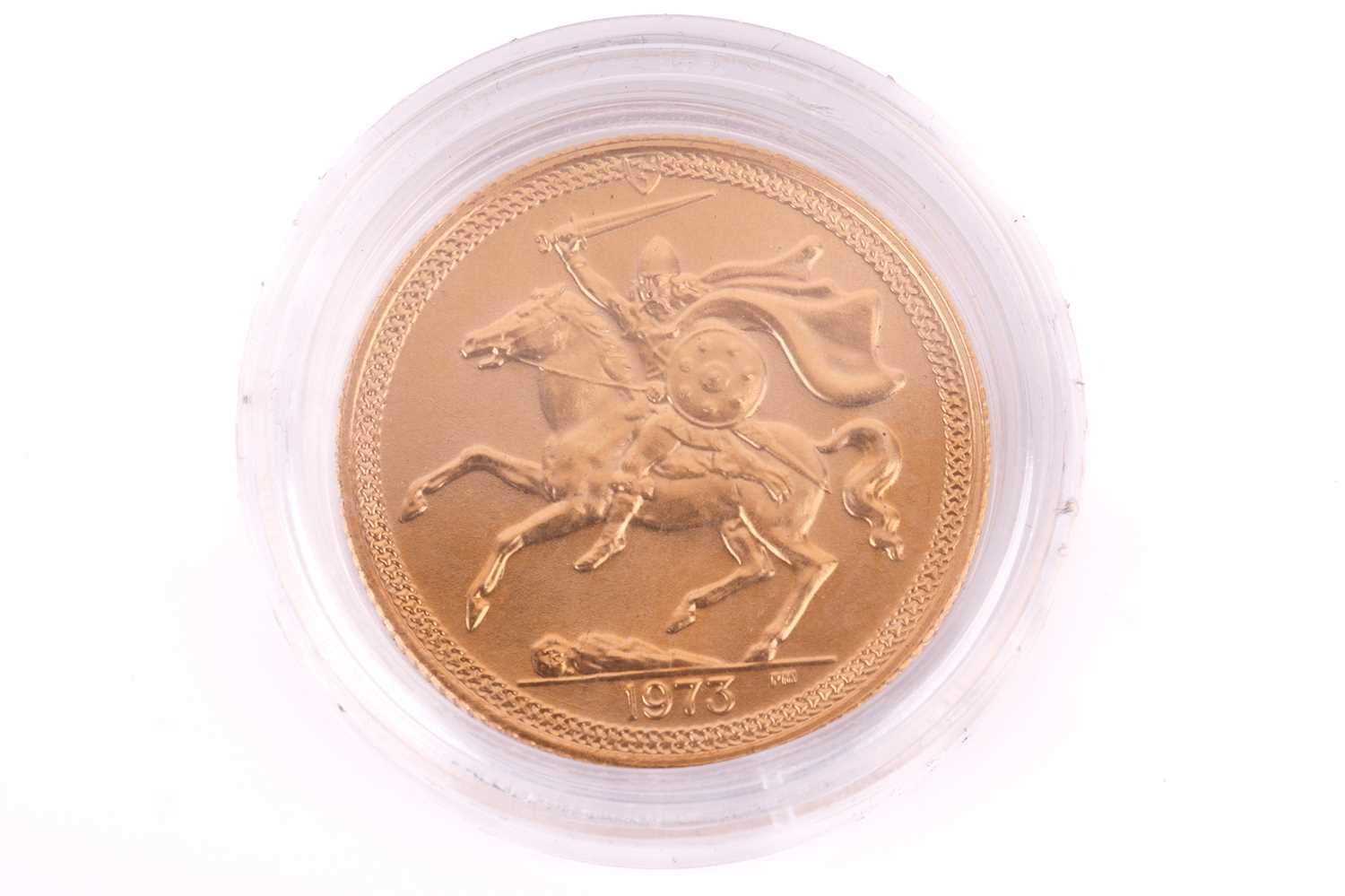 A 1973 Isle Of Man Elizabeth II Full-Sovereign with a plastic case, circulated.