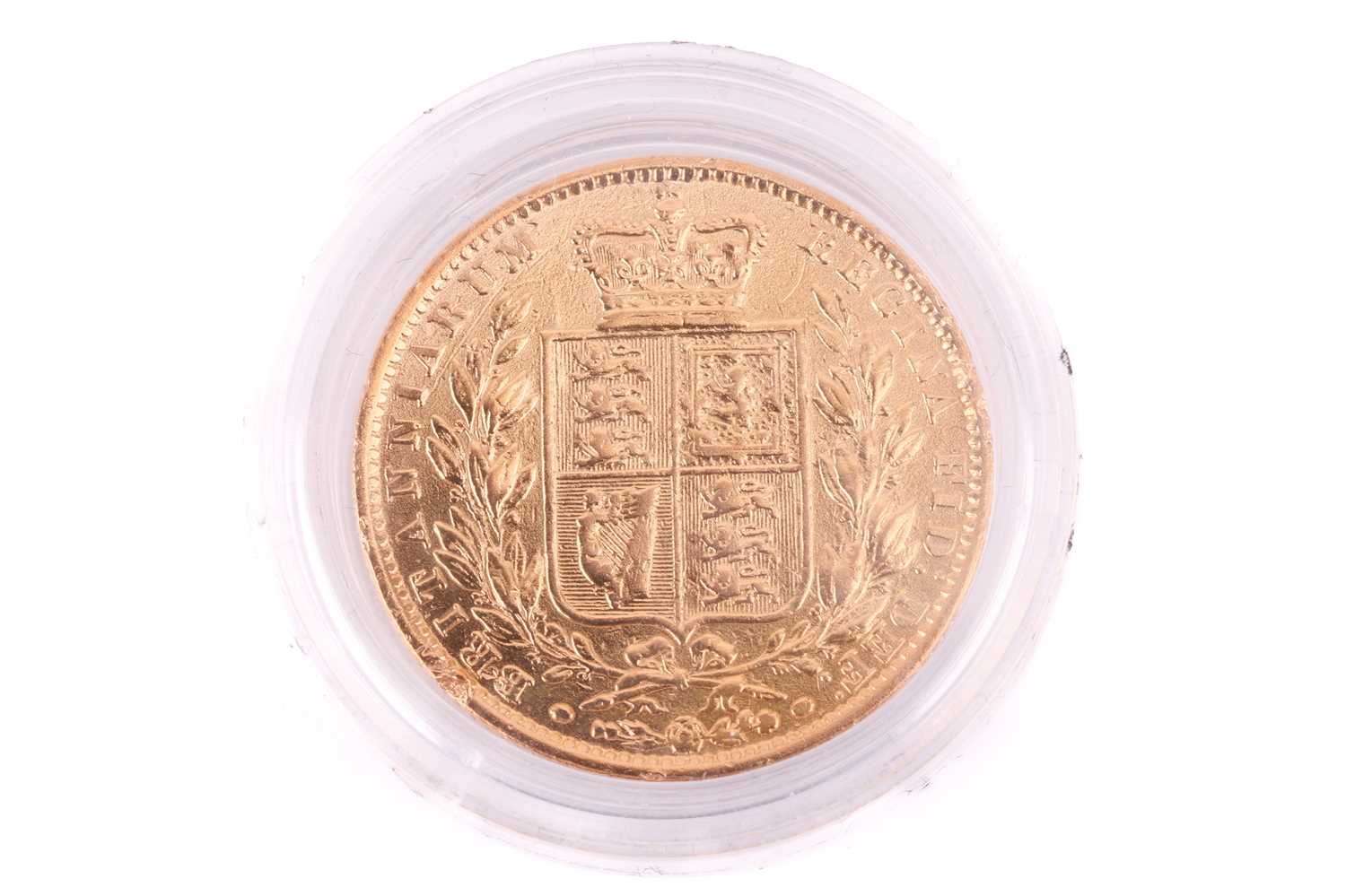 An 1863 Victoria 'young head' Full-Sovereign shield back with a plastic case, circulated.