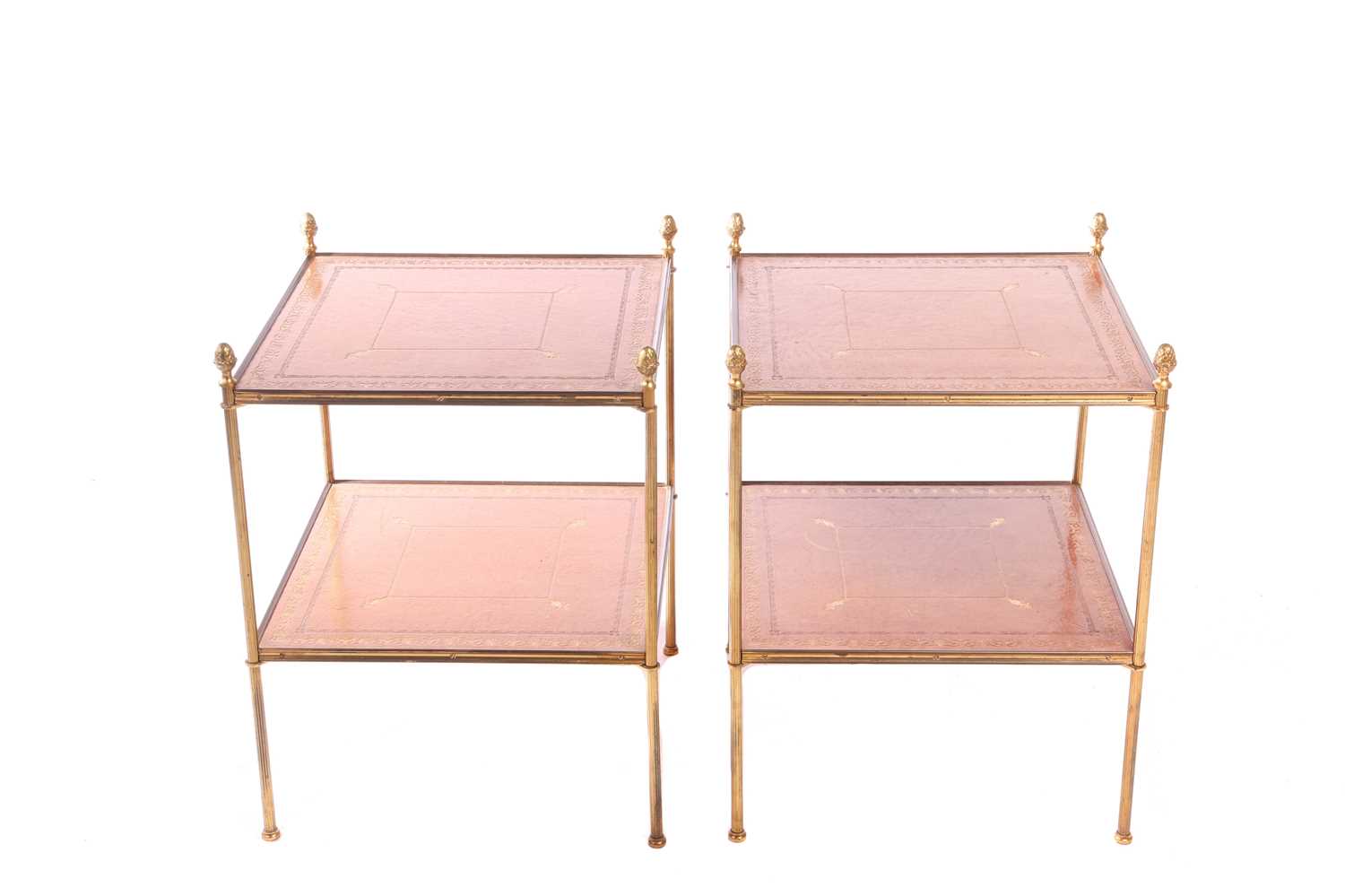 A pair of French mid-century étagères, two-tiered with tooled leather tops and fluted brass uprights