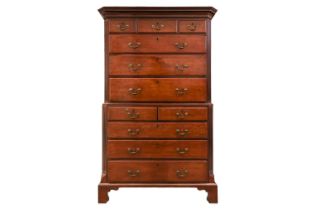 A George III mahogany chest on chest with canted and fluted corners, the upper carcass with three sh