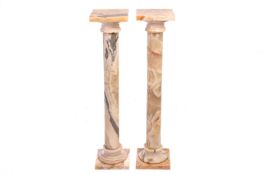 A pair of marble pedestals, 23 cm wide x 23 cm deep x 102 cm highTop marble panel of one column lose