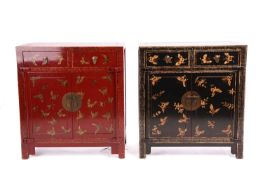 A contrasting pair of Chinese red and black "Chinoiserie" lacquer cabinets each with captive panelle