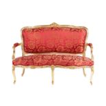 A 20th century Louis XV-style canape settee, with carved and molded wood and gilt gesso outline, stu