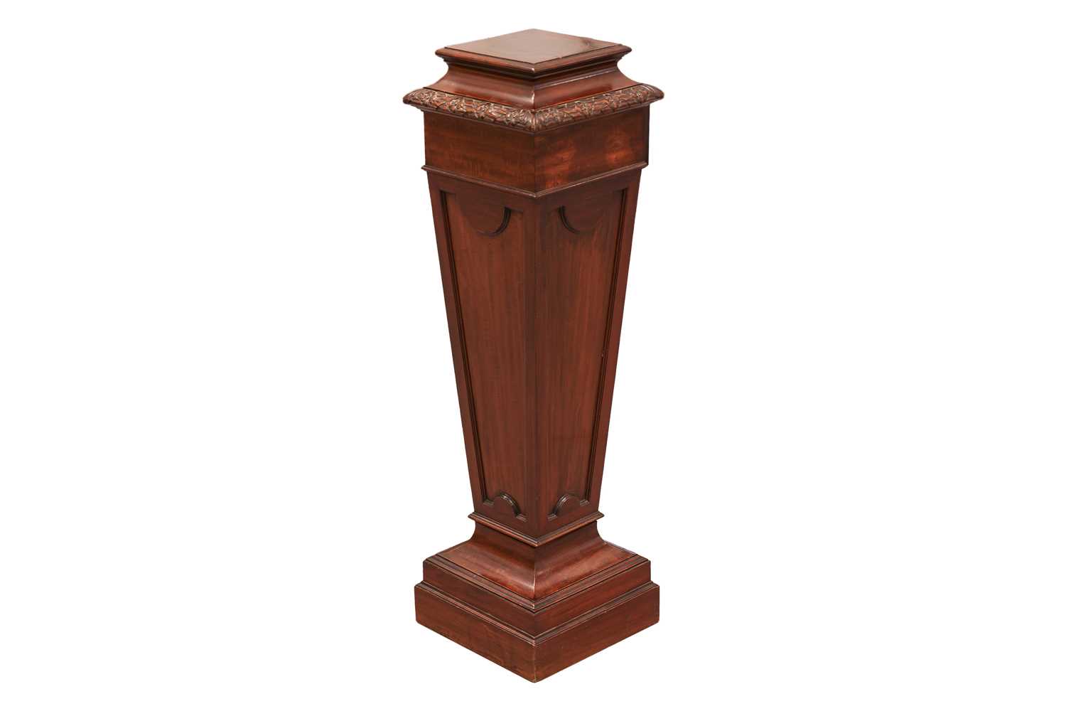 An Edwardian mahogany square section pedestal of Neo-Classical form with decorative carved and mould