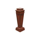 An Edwardian mahogany square section pedestal of Neo-Classical form with decorative carved and mould