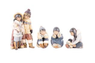 A collection of Lladro Eskimo figurines, comprising of artic allies, a pensive Eskimo girl, a