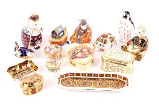 A collection of Royal Crown Derby paperweights, comprising a drummer bear, a honey bear, a wren, and