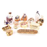 A collection of Royal Crown Derby paperweights, comprising a drummer bear, a honey bear, a wren, and