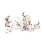 A collection of eight Lladro figurines comprising Sunday in the park, the serenade, a boy with dog, 