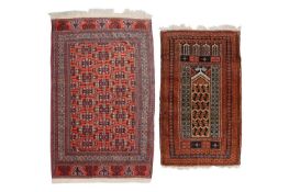 A red ground Turkoman rug with rows of composite guls within multiple borders and rams horn ends, 20