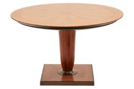 A 20th century Italian, circular tulip-wood effect breakfast table, with a segmented top, on a turne