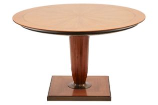 A 20th century Italian, circular tulip-wood effect breakfast table, with a segmented top, on a turne