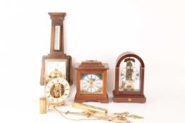 A collection of clocks comprising a Sewills of Liverpool arched top skeleton mantle clock, 20th cent