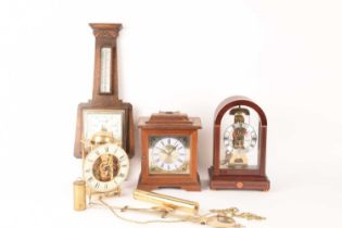 A collection of clocks comprising a Sewills of Liverpool arched top skeleton mantle clock, 20th