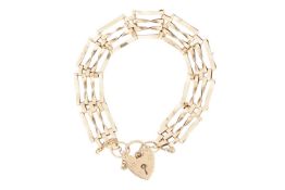 A gate link bracelet in 9ct yellow gold, formed of four rows of plain and twisted links, completed w