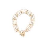 A gate link bracelet in 9ct yellow gold, formed of four rows of plain and twisted links, completed w