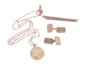 A group lot of gold jewellery consisting of a St Christopher pendant and chain, a pair of cufflinks 