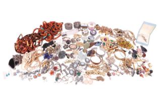 A large quantity of costume jewellery consisting of plated and silver necklaces, bracelets and earri