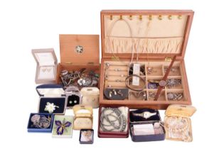 A quantity of costume jewellery and fashion watches, including a white metal and enamel brooch in th