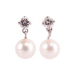 A pair of diamond and cultured pearl drop earrings, each set with a single round brilliant cut diamo