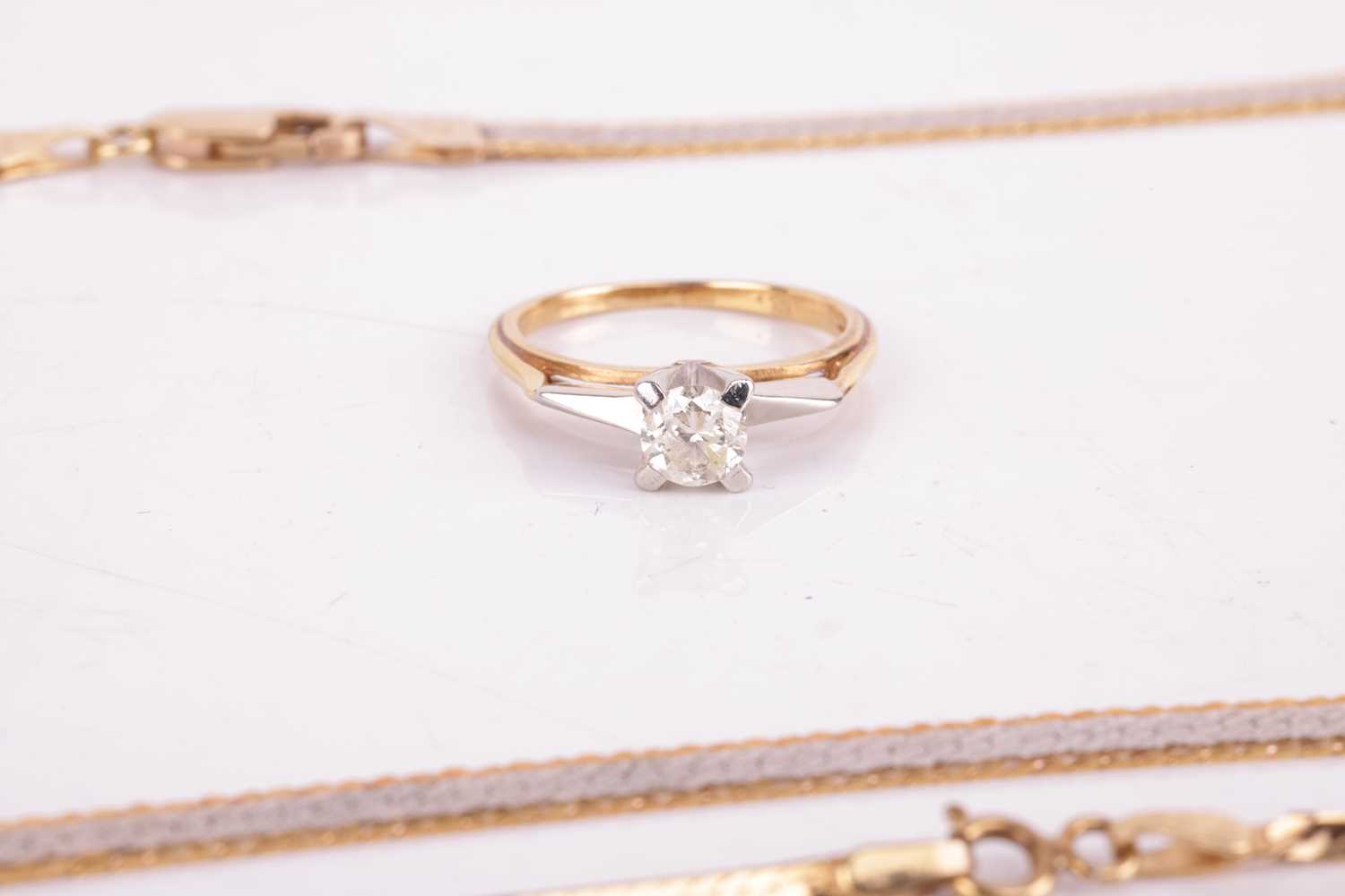 Two 9ct gold necklaces and a diamond solitaire ring; the first necklace consists of a flat herringbo - Image 2 of 3