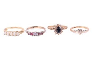 Four gem set rings, comprising a sapphire and CZ cluster ring with hallmarks for 9ct gold, ring size