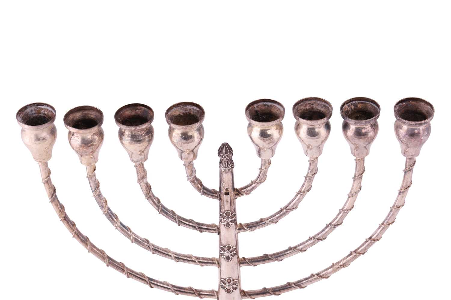 A Hanukkah menorah, an eight-branched candelabrum with twisted cable work decoration, supported on a - Image 4 of 4