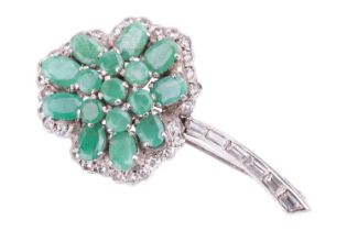 An emerald-set shamrock brooch, the oval mixed-cut emeralds centrally set in a trefoil pattern, surr