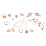 A collection of jewellery items including a 9ct gold floral ring, a pair of 9ct gold twist earrings,